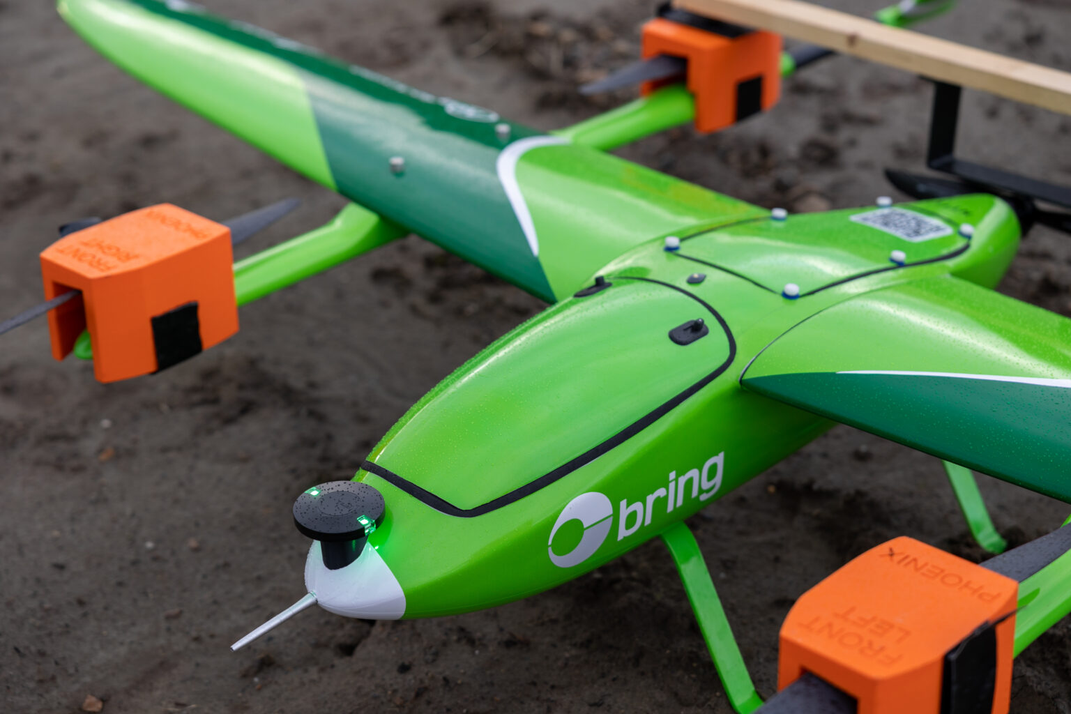 An image of a green drone with the Posten Bring logo on it