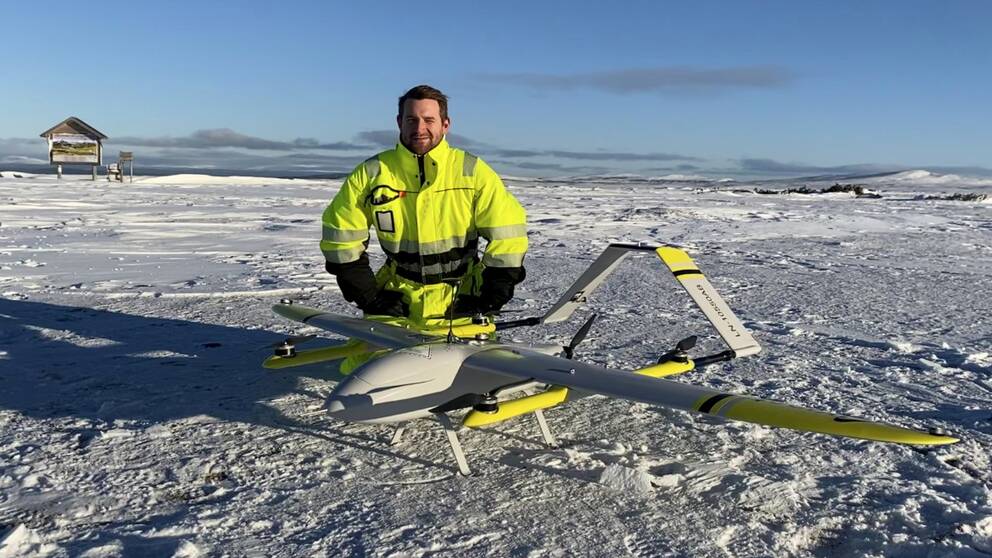A technician with a drone in a cold climate